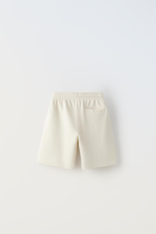 Short jogging texto relieve